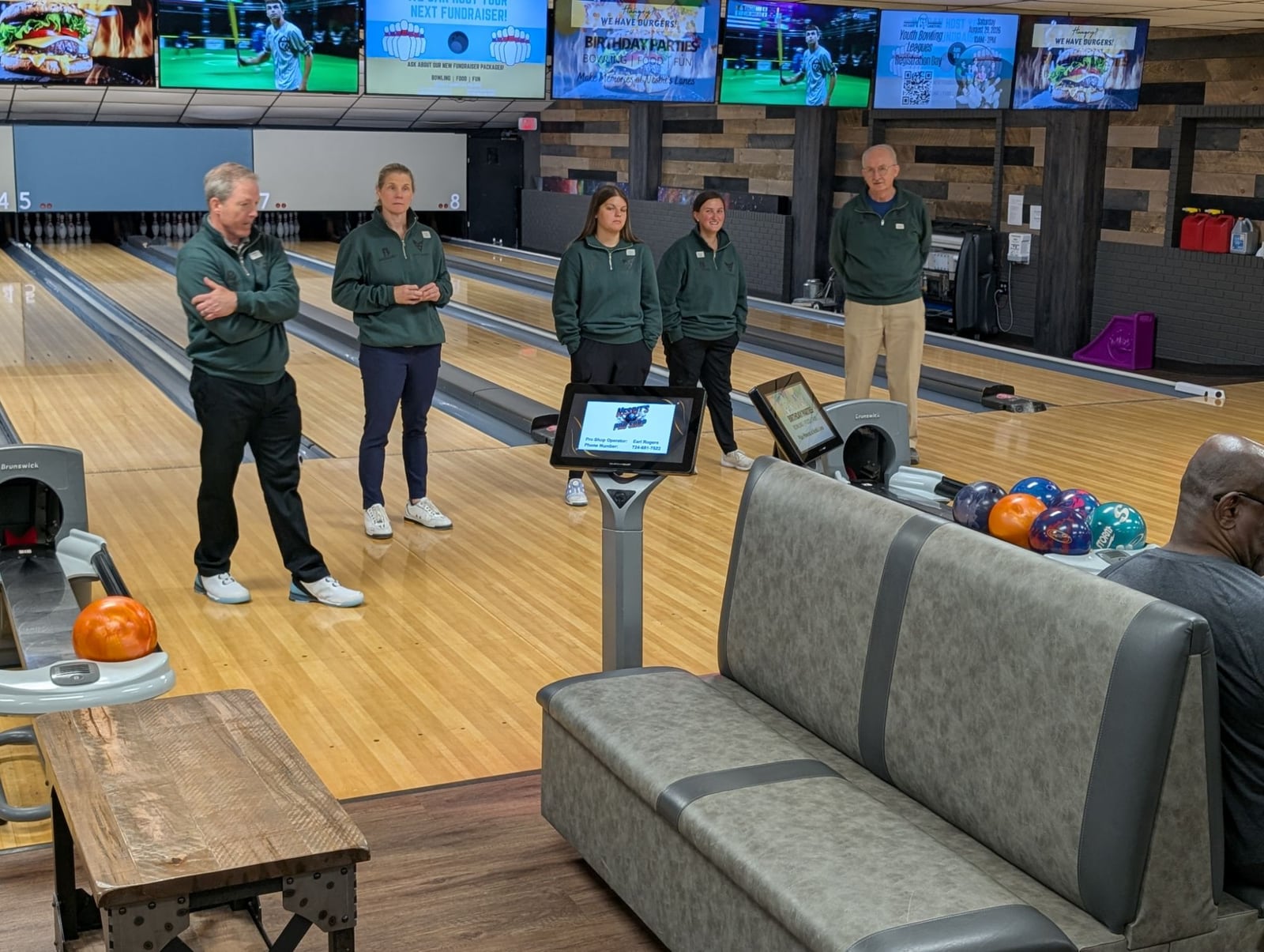 Mike Shady with fellow coaches on the lanes at a camp